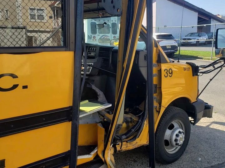 Before: front-end collision damage on a yellow Collins school bus